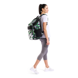 Woman wearing a green and black patterned backpack on a white background