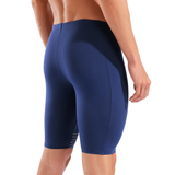 Navy blue athletic shorts worn by a person on a white background