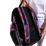 Person holding arena Floral backpack showing padded straps and mesh back panel